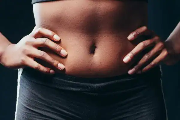 Toning Your Stomach: The Ultimate Guide to Achieving a Sculpted Stomach While Shedding Pounds 1 Image of a toned stomach after non surgical treatment Harlow